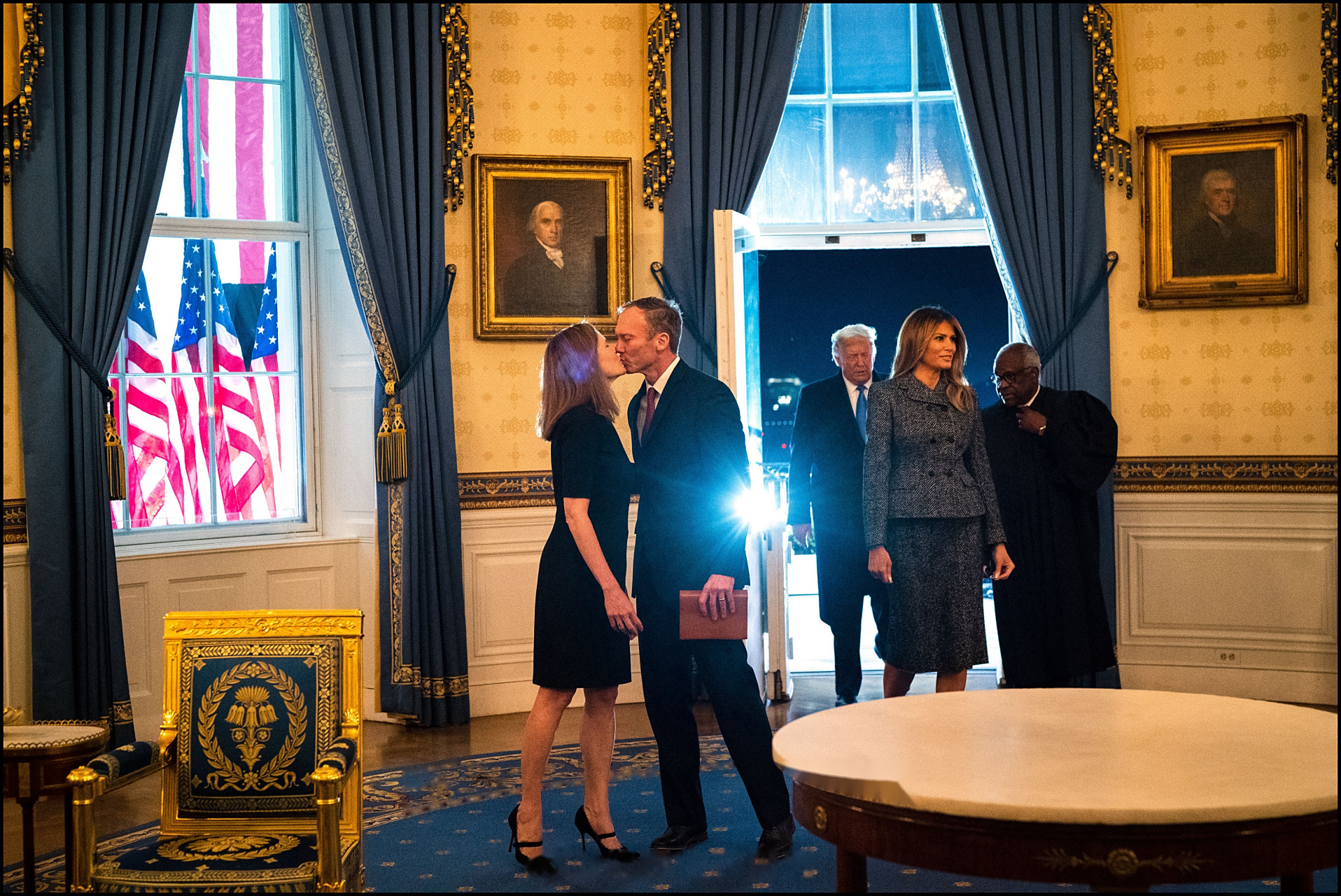 supreme court justice gets a kiss from her husband.