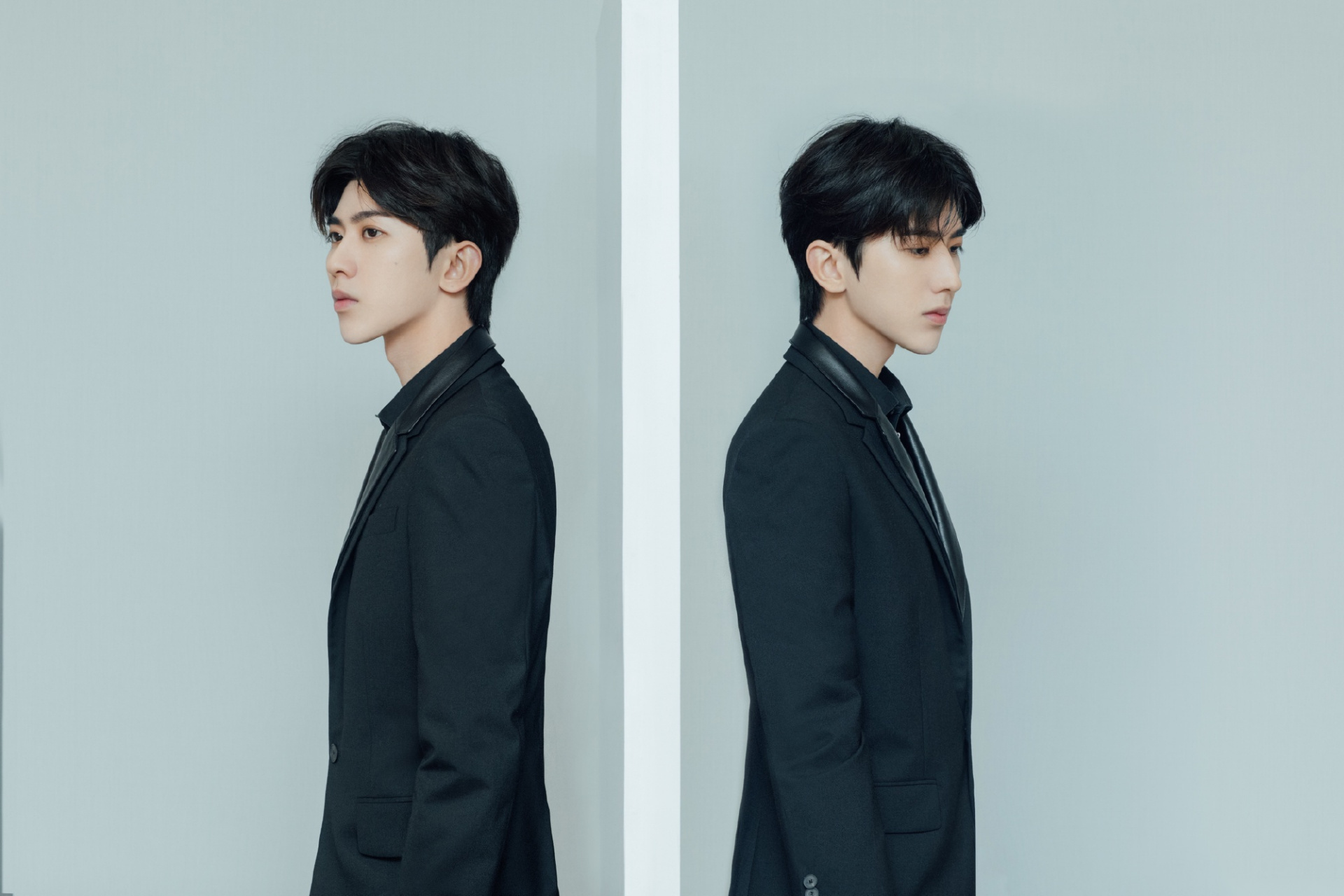 蔡徐坤身穿黑色拼接西装精致帅气